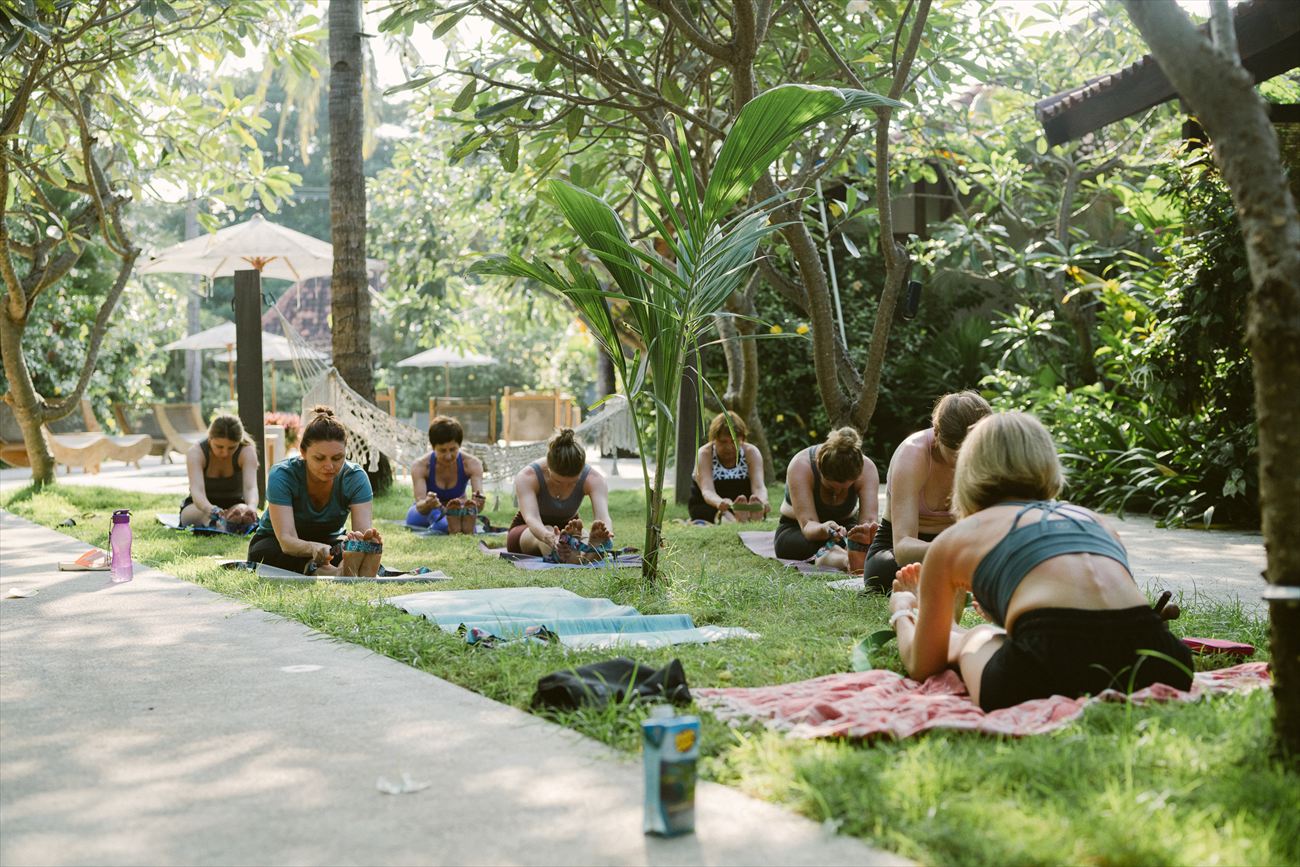 The group practising on the lawn in the morning light