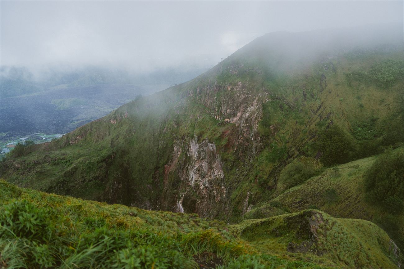 A green mountain ridge under low cloud