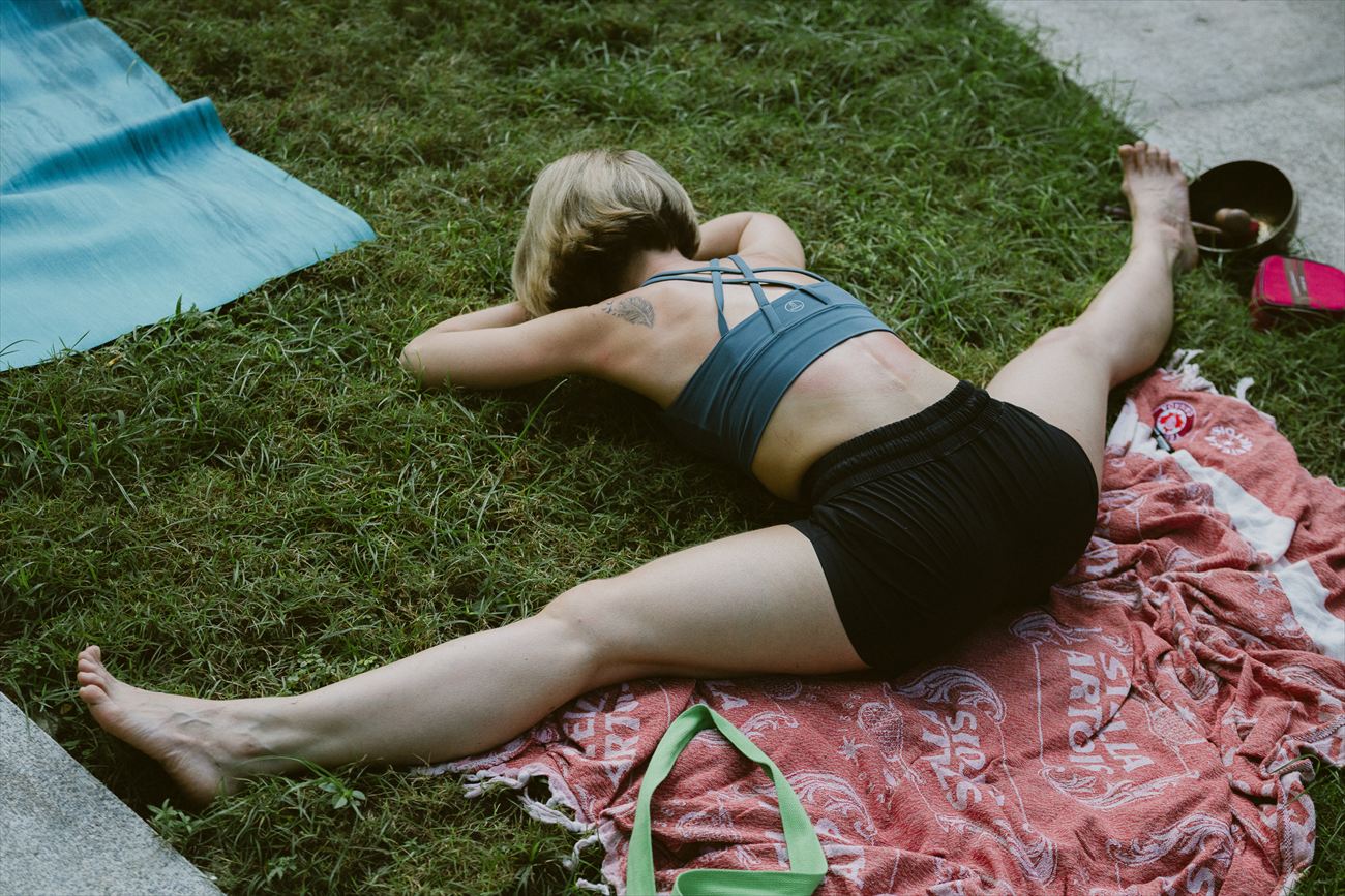 Resting on a patterned cloth on the grass after practice