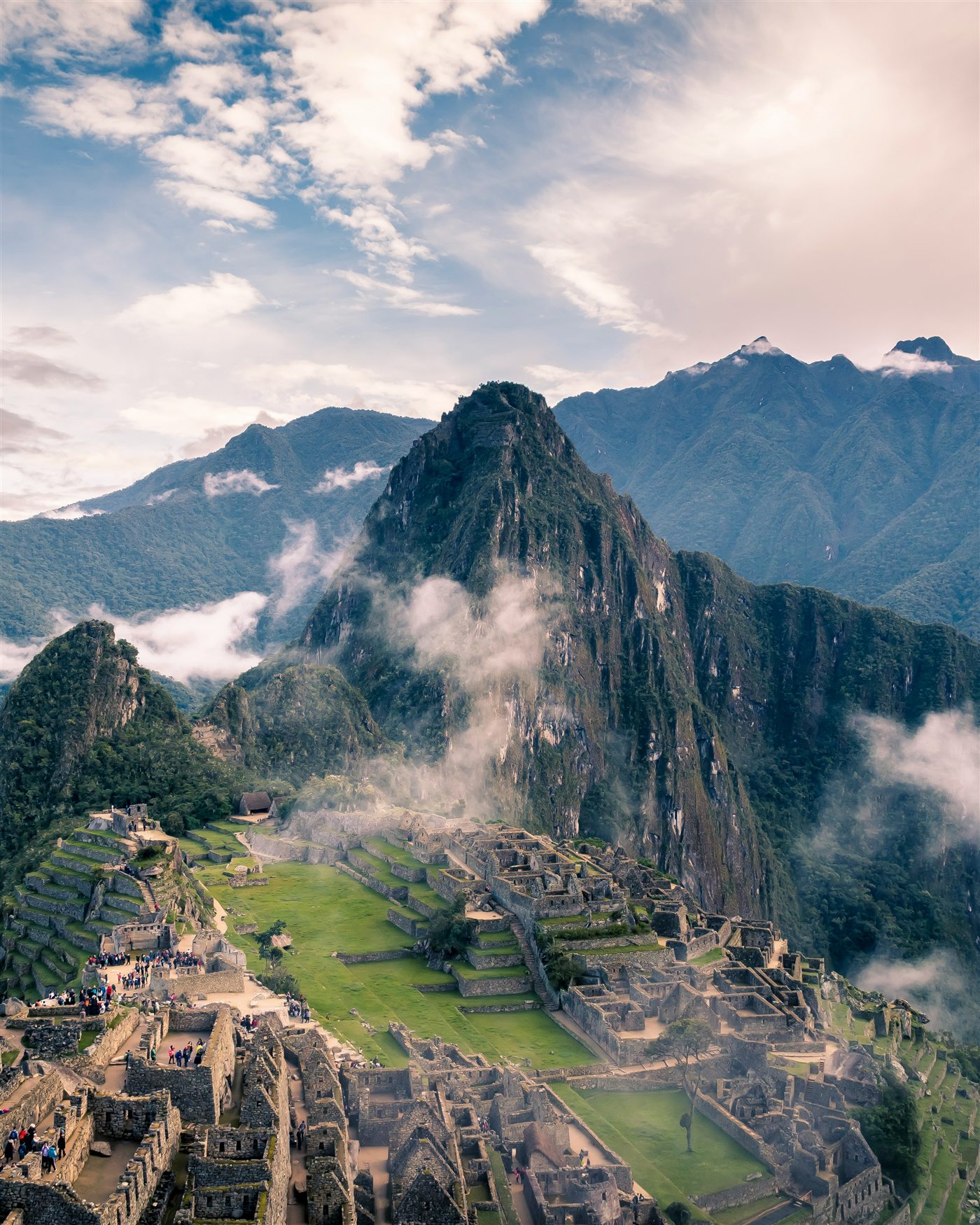 Machu Picchu with cloud drifting through the Andes at first light